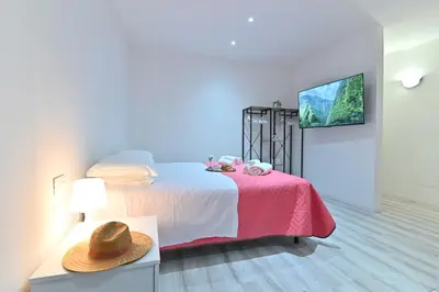 Letto o letti in una camera di IzzHome The Breeze