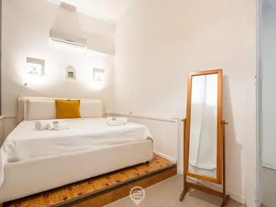 Letto o letti in una camera di La Maisonnette