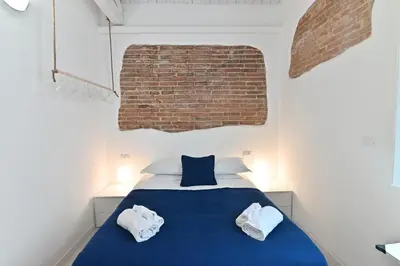 Letto o letti in una camera di IzzHome City Heart Rooms