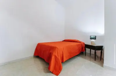 Letto o letti in una camera di Casa Sara