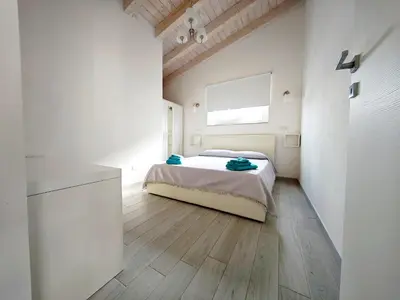 Letto o letti in una camera di villa ELEGANCE charming PORTO PINO