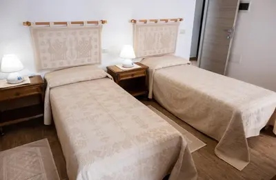 Letto o letti in una camera di B&B Ruinas