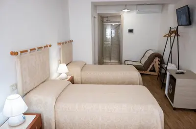 Letto o letti in una camera di B&B Ruinas