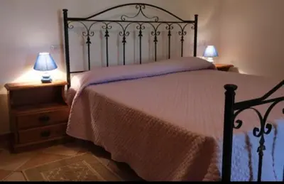 Letto o letti in una camera di Casa Vacanze il Giardino