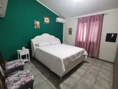 Letto o letti in una camera di Appartamento le Magnolie
