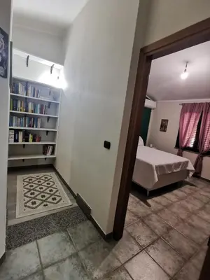 Letto o letti in una camera di Appartamento le Magnolie