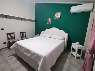 Letto o letti in una camera di Appartamento le Magnolie