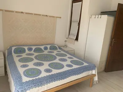 Letto o letti in una camera di Villa Lussu