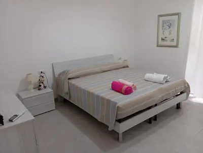 Letto o letti in una camera di Casa Anna