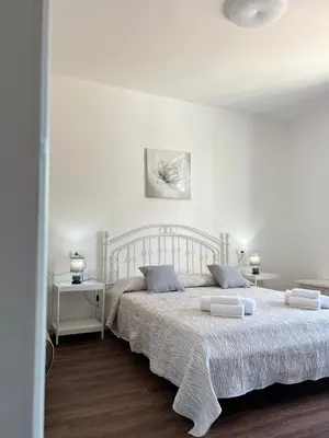 Letto o letti in una camera di Harmony Affittacamere