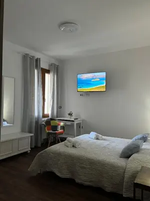 Letto o letti in una camera di Harmony Affittacamere