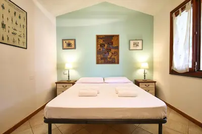 Letto o letti in una camera di Casa Giuliana