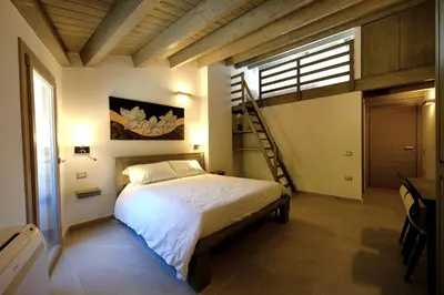 Letto o letti in una camera di ZENITH Rooms