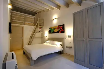 Letto o letti in una camera di ZENITH Rooms