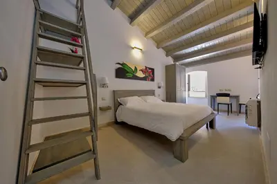 Letto o letti in una camera di ZENITH Rooms