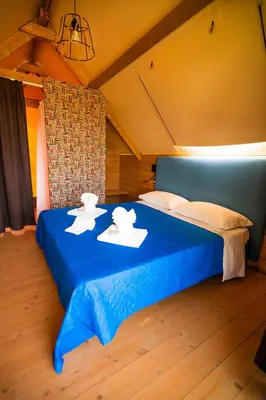 Letto o letti in una camera di AgriGlamping Munai