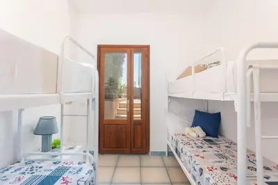 Letto o letti in una camera di Funtana Meiga - Prima fila fronte mare - Ca' Teresa