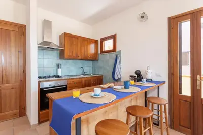 Cucina o angolo cottura di Funtana Meiga - Prima fila fronte mare - Ca' Teresa