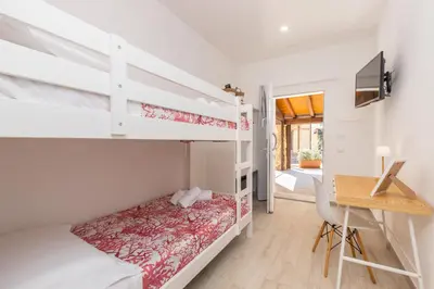 Letto o letti in una camera di Mariposa Rooms