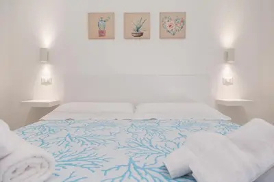 Letto o letti in una camera di Mariposa Rooms