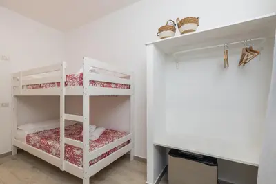 Letto o letti in una camera di Mariposa Rooms