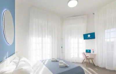 Letto o letti in una camera di Maddalena Rooms - Eja Sardinia