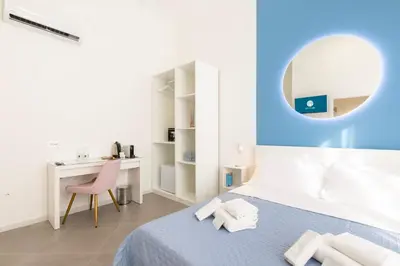 Letto o letti in una camera di Maddalena Rooms - Eja Sardinia