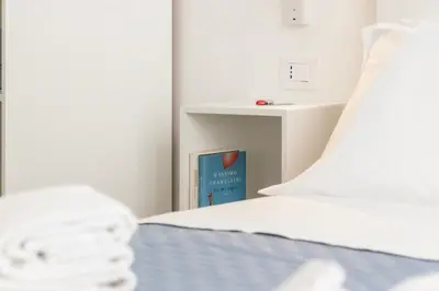 Letto o letti in una camera di Maddalena Rooms - Eja Sardinia
