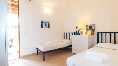 Letto o letti in una camera di Villa Brezza di Mare-Geremeas Country Club