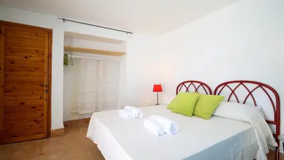 Letto o letti in una camera di Villa Brezza di Mare-Geremeas Country Club