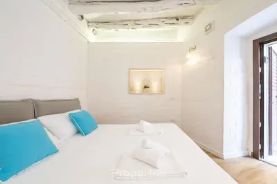 Letto o letti in una camera di Cagliari Boutique Stay by Propertize