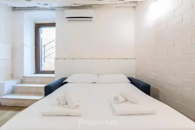 Letto o letti in una camera di Cagliari Boutique Stay by Propertize