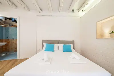 Letto o letti in una camera di Cagliari Boutique Stay by Propertize