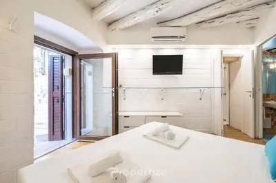 Letto o letti in una camera di Cagliari Boutique Stay by Propertize