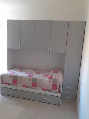 Letto o letti in una camera di Casa Peonia