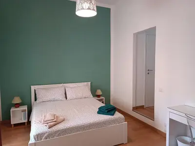 Letto o letti in una camera di La Casetta d'Oro - Cagliari