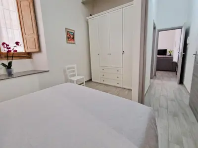 Letto o letti in una camera di Cagliari Marina Paradise