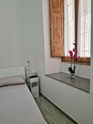 Letto o letti in una camera di Cagliari Marina Paradise