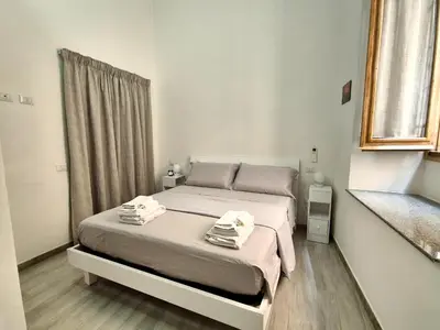 Letto o letti in una camera di Cagliari Marina Paradise