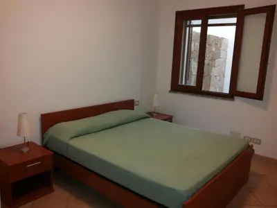 Letto o letti in una camera di Villetta via del mirto