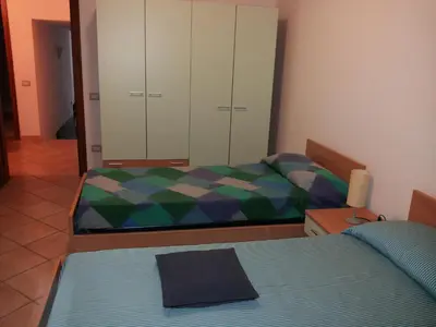 Letto o letti in una camera di Villetta via del mirto