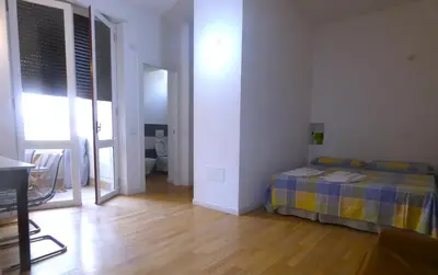 Letto o letti in una camera di Splendido open space, a 10 min a piedi dal Centro IUNS2308