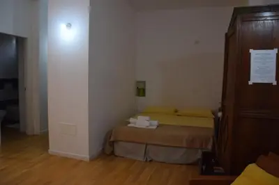 Letto o letti in una camera di Splendido open space, a 10 min a piedi dal Centro IUNS2308