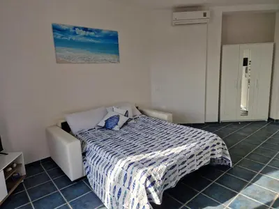 Letto o letti in una camera di Corallo Bilocale Vista Collina