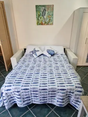 Letto o letti in una camera di Corallo Bilocale Vista Collina