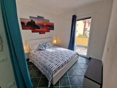 Letto o letti in una camera di Corallo Bilocale Vista Collina