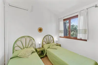 Letto o letti in una camera di Villa Bianca