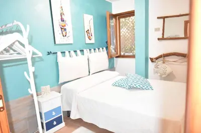 Letto o letti in una camera di Chia Villa Giada