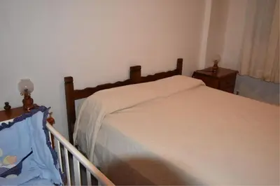 Letto o letti in una camera di Bifamiliare GIUNONE