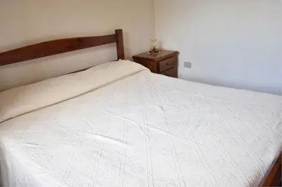 Letto o letti in una camera di Bifamiliare GIUNONE